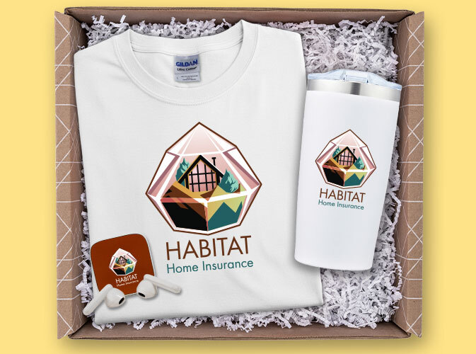 Gift box containing branded merchandise for Habitat Home Insurance, including a white T-shirt, a white travel tumbler, a phone grip, and packaging filler.